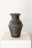 District Loom Decor Imported Black Clay Vase from Asia This imported Black Clay Vase is crafted with a durable black clay and built to withstand years of use and display. One-of-a-kind