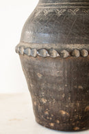 District Loom Decor Imported Black Clay Vase from Asia This imported Black Clay Vase is crafted with a durable black clay and built to withstand years of use and display. One-of-a-kind