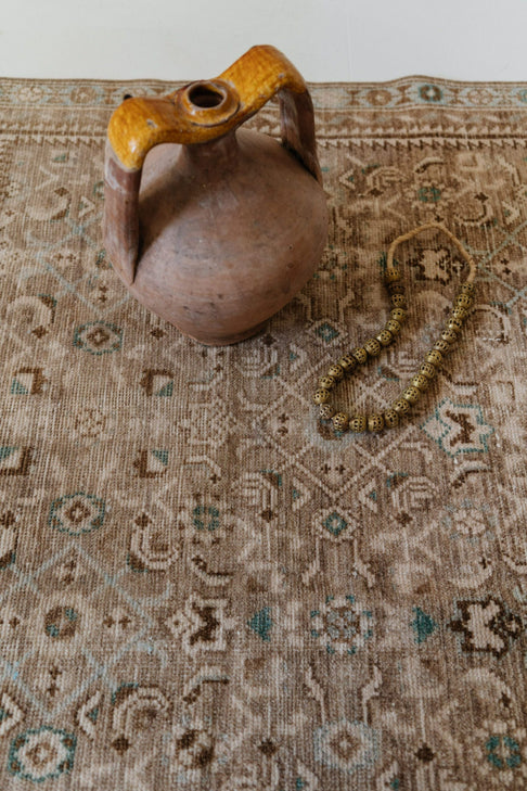 District Loom Decor Collected brass perforated beads strung on jute rope perfect for styling atop coffee table books for added visual intrigue and texture