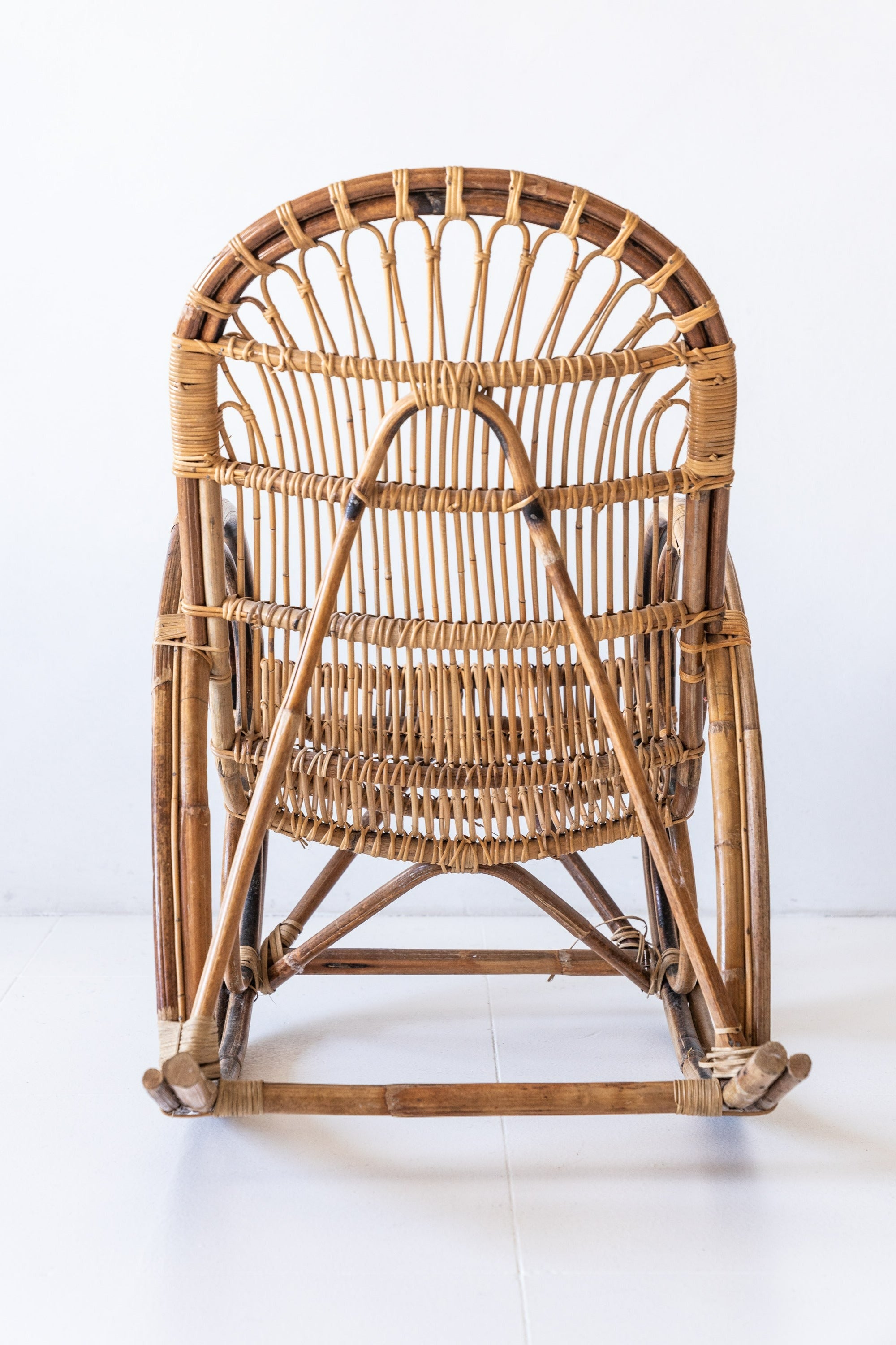 District Loom Furniture Vintage Rattan Loop Rocking Chair