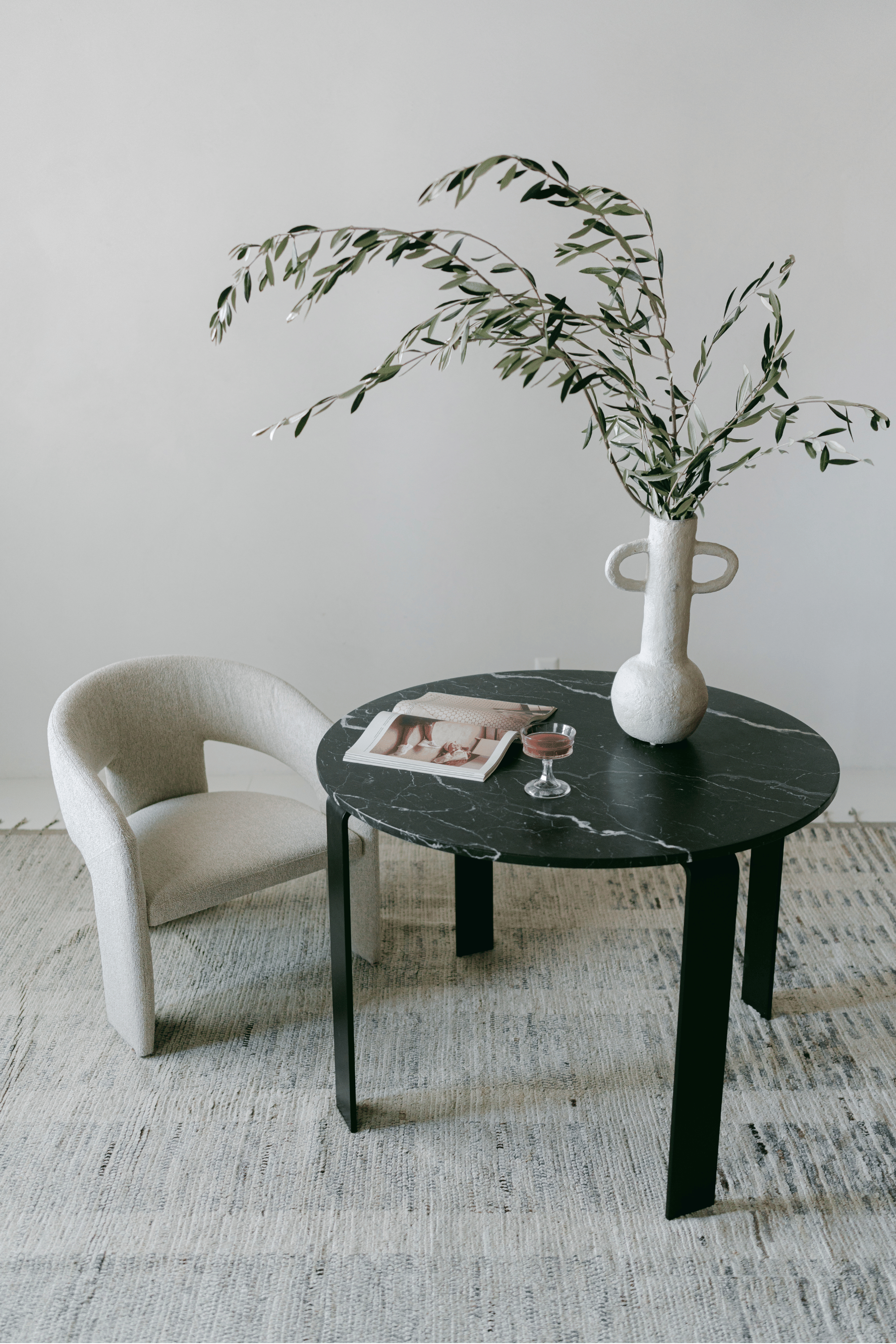 District Loom Furniture Nero Marquina Marble round table honed finish locally sourced from natural marble stone remnant and handcrafted to serve as a sustainable sculptural element in your home